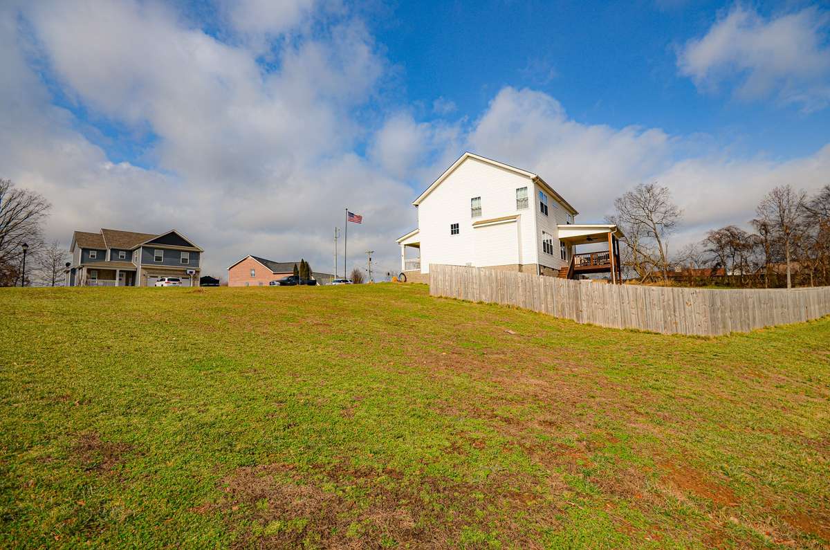 I am standing inside the boundary line. You could potentially build another home, garage or shop on this side of the property. NO HOA.