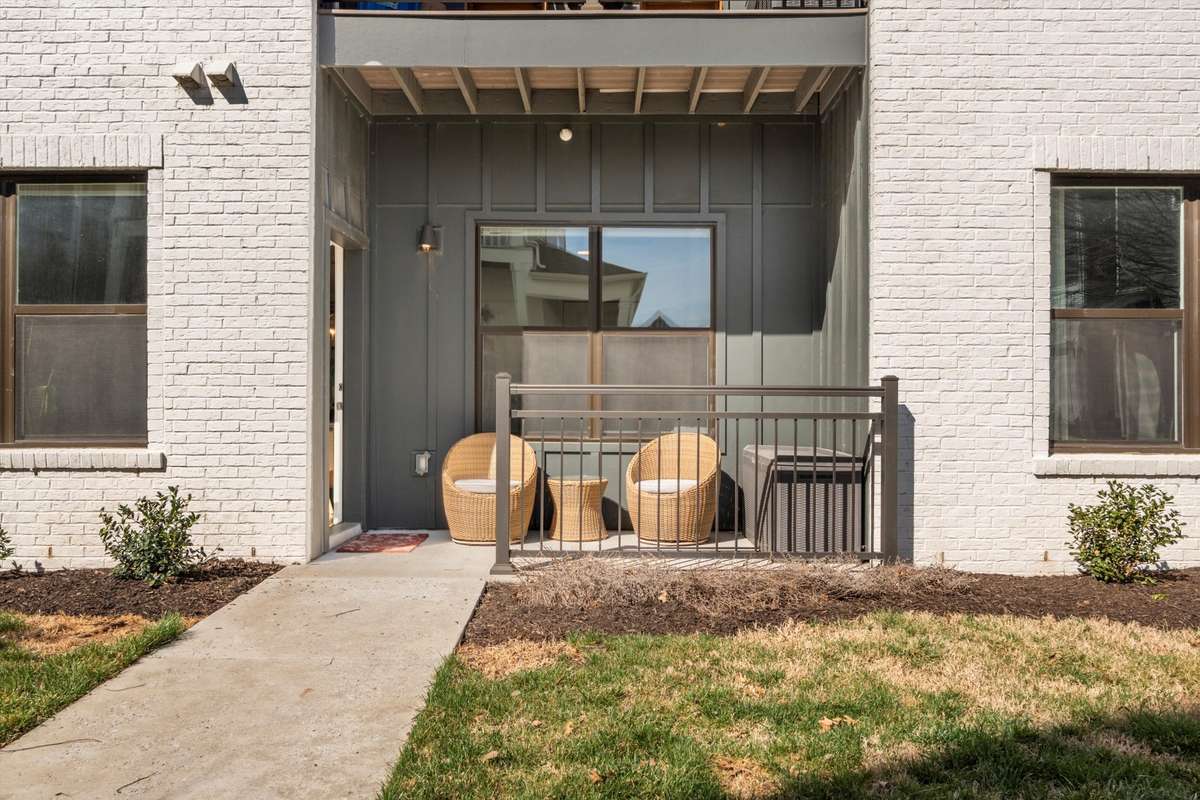 FIRST FLOOR UNIT — COVERED PORCH THAT OPENS UP TO GREEN SPACE AND SIDEWALKS — NO STEPS