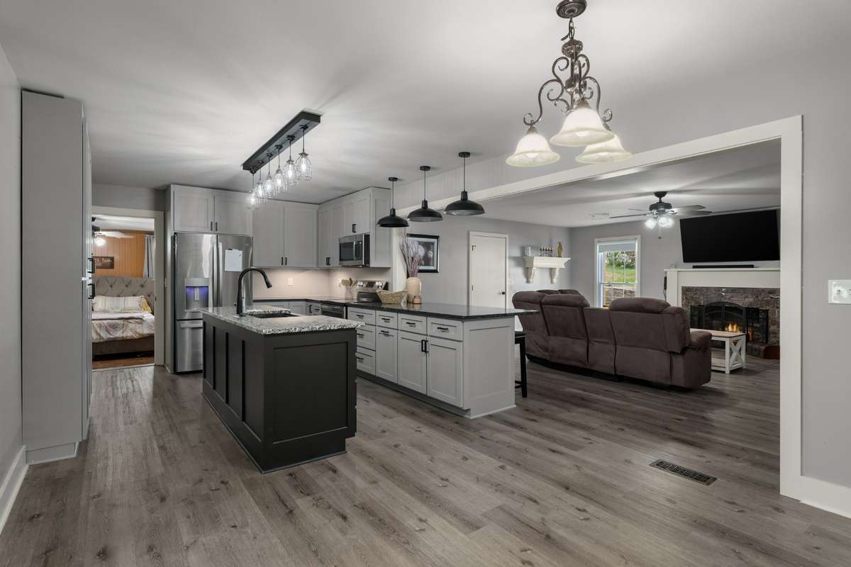 Renovated kitchen has Stainless steel appliances, LVP flooring, granite counter tops.