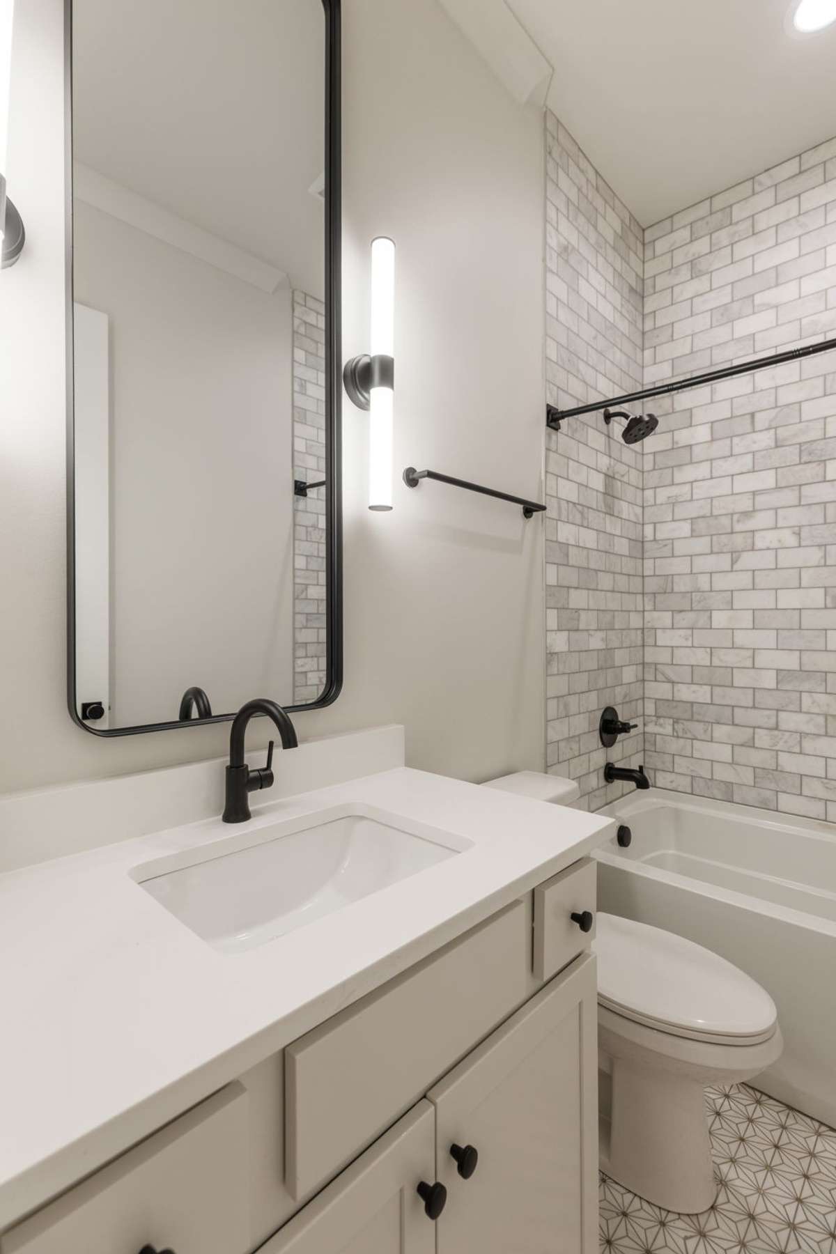 Designer Full Bath on Main - luxury tile flooring and tile bath.