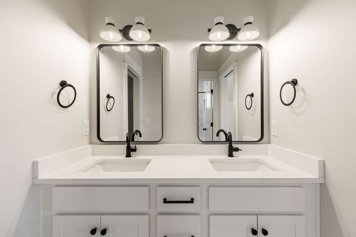 Shared bathroom between two upstairs bedrooms with double vanities!
