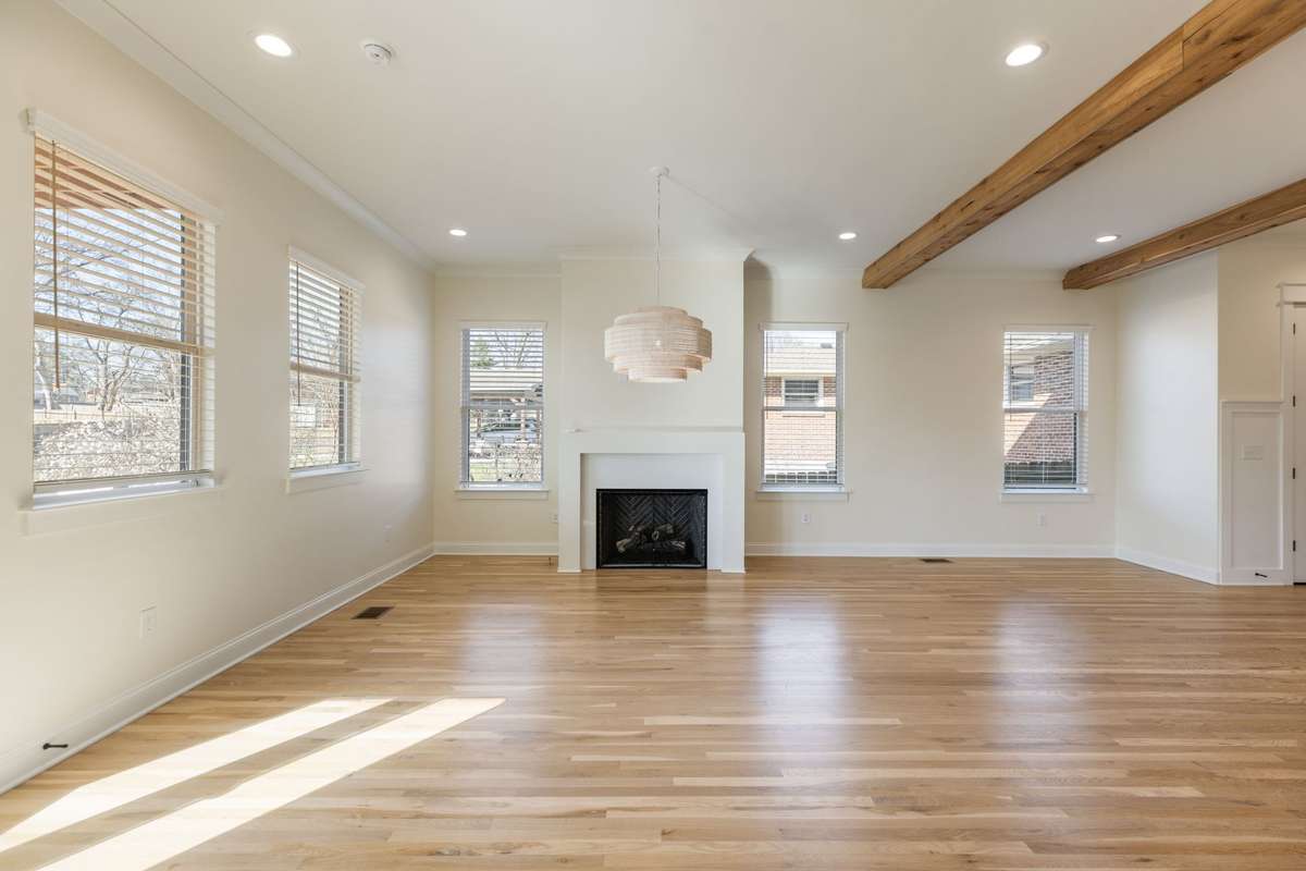 Blinds throughout home, lots of natural light and beautiful floors, beams, finishes.
