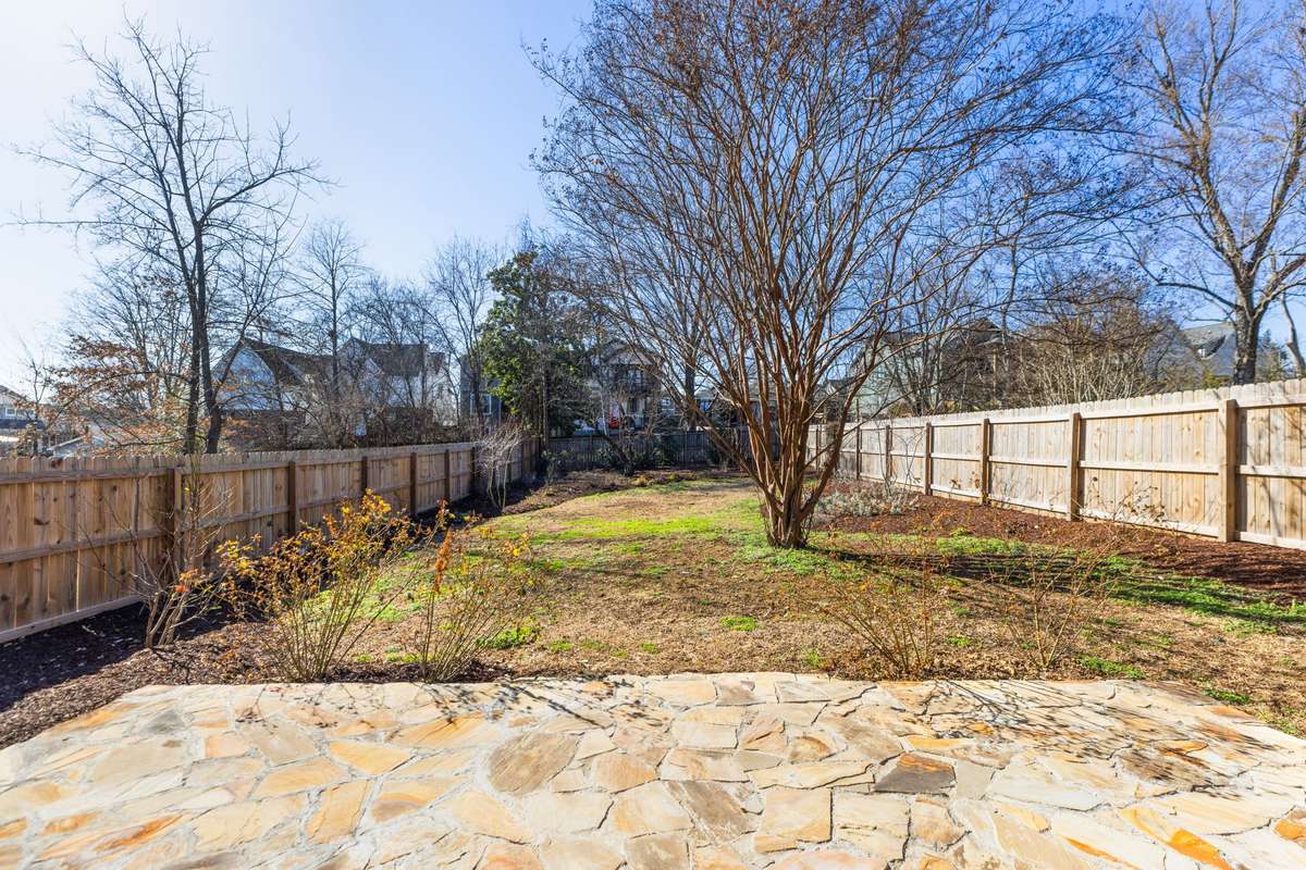 Stunning stone patio / sitting area overlooking amazing landscaping features.