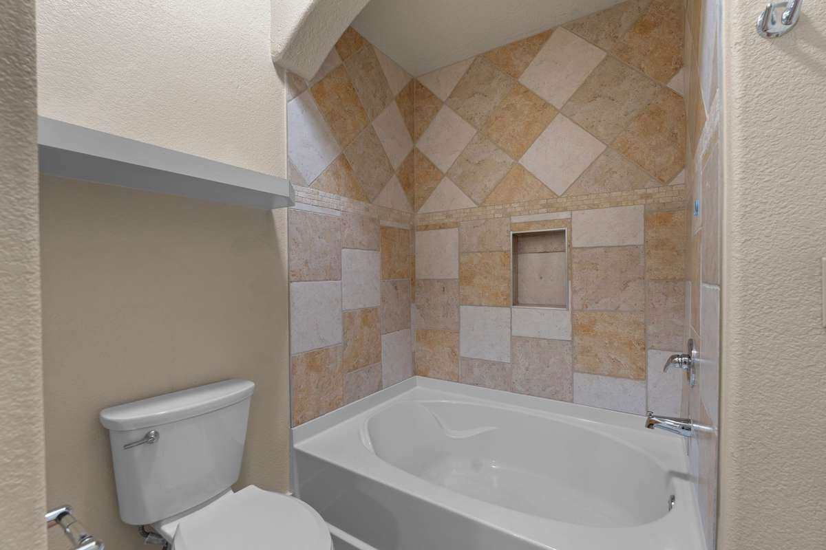 Beautiful tile details and a soaker tub.