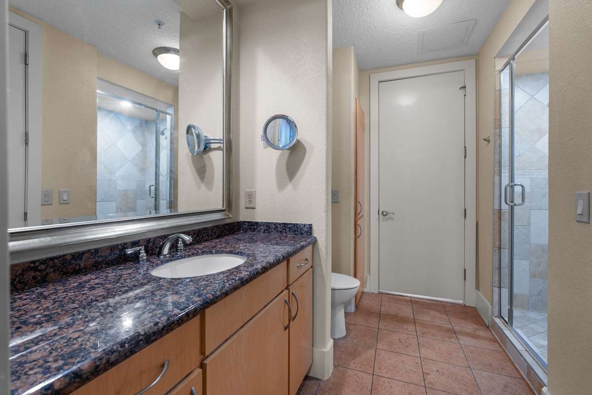 Second bath with generous vanity space, linen closet and walk-in shower.