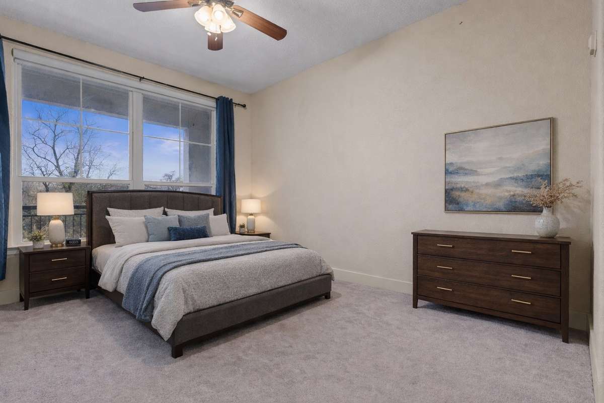 Primary bedroom with outdoor views and natural light.
