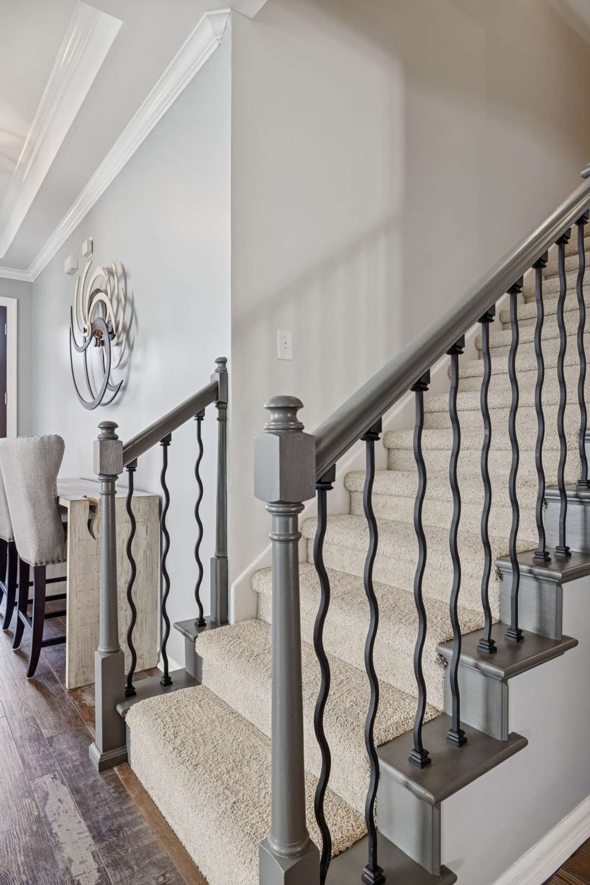Stairway - Leading upstairs to the Huge 500 plus sq.ft. Rec/Bonus Room.  Notice the custom black iron spindles for that extra touch of class.