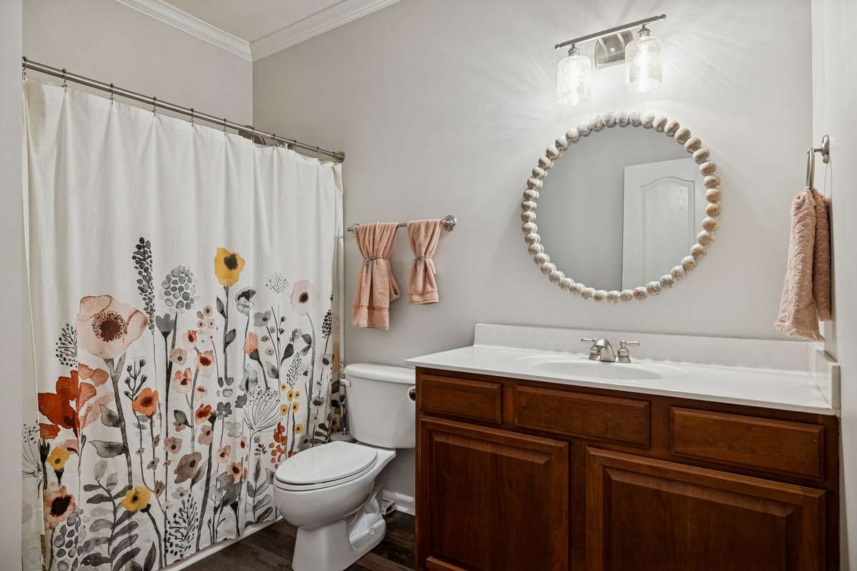 Full Bathroom - Located on the main floor.  You'll love the space of this room along with the new light fixture and mirror.  Serving for Bedroom #2 and Bedroom #3.