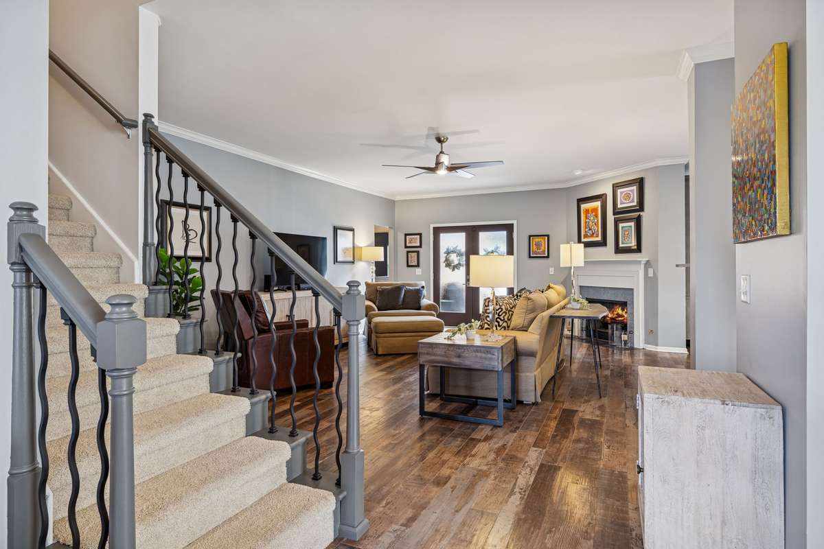 Living Room - Looking toward the back of the home. You will love the beautifully done flooring that carries on throughout the entire main level.
