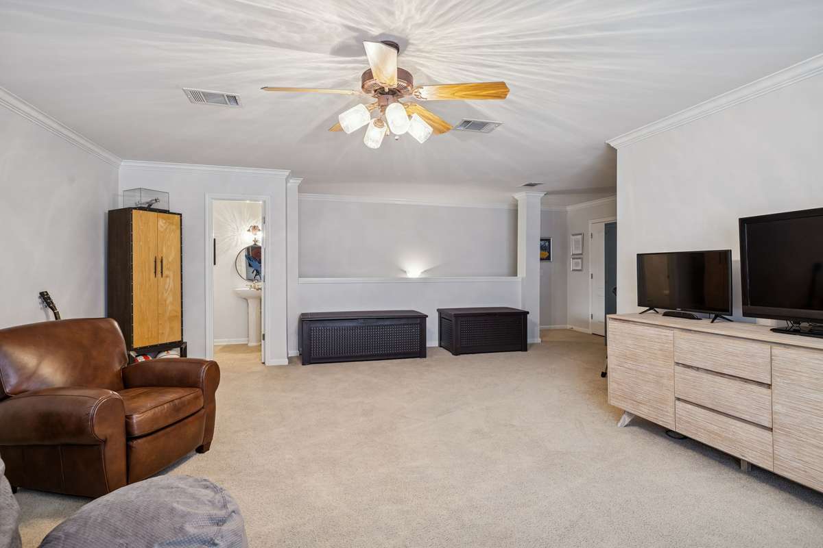 Bonus Room - The door to the left leads you to the half bath.  To the right leads you back down the stairs to the main level.