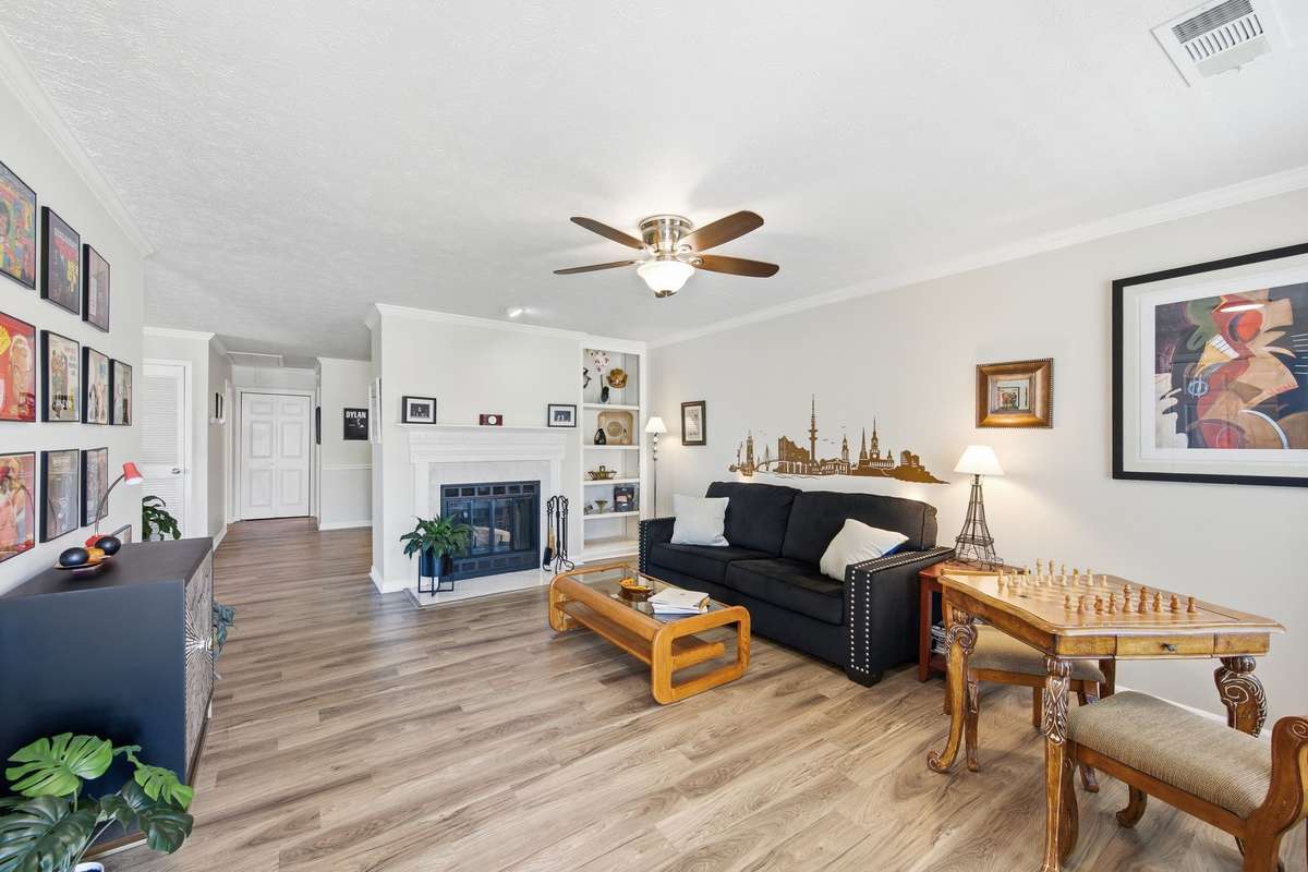 Spacious living area with a wood burning fireplace.