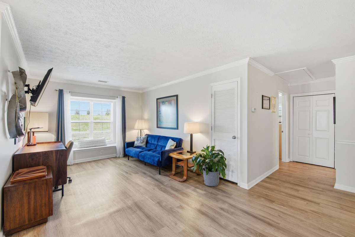 Flex Space with window seat.  The space is currently being used as an office and TV lounge.
Your pets and plants will enjoy sitting in the window seat while you work or workout.