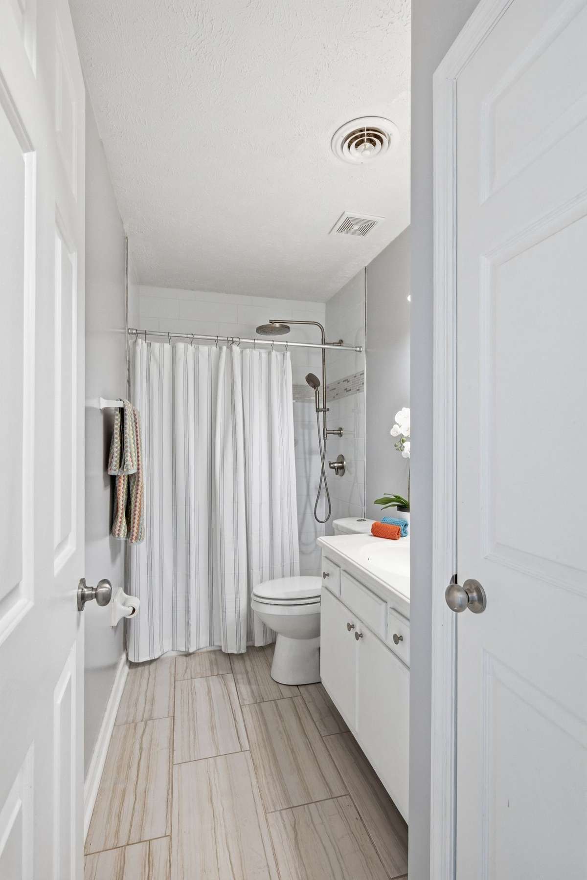 Full Bath with a walk-in shower and linen closet.