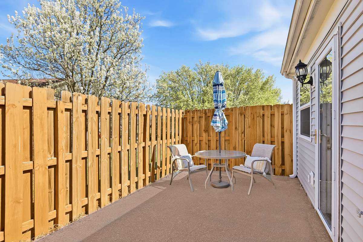 The back patio is located out the kitchen backdoor which makes it convenient for private outdoor dining while the sun is setting overhead.