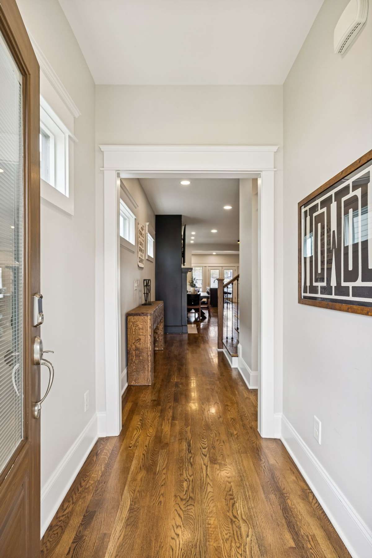 Bright, airy entry hall with hardwood floors and a seamless flow into the main living spaces.