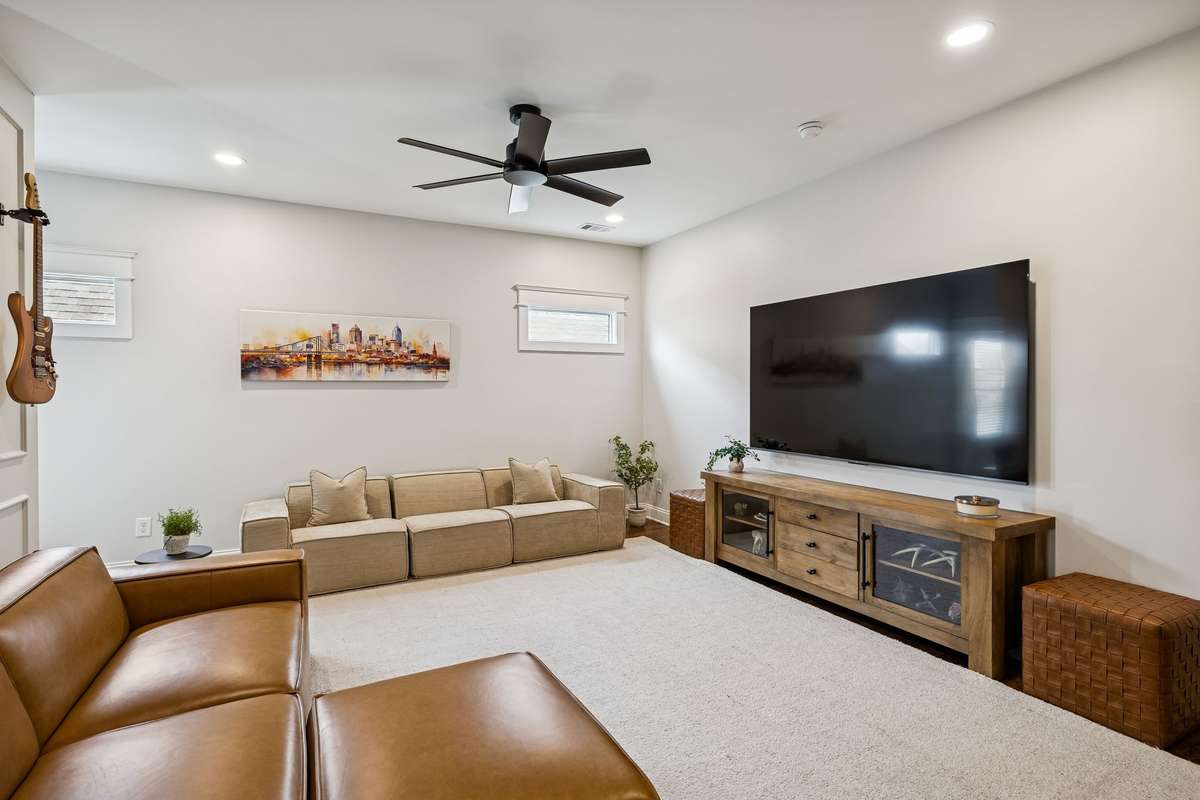 Secondary living or media space with generous scale and flexible use.