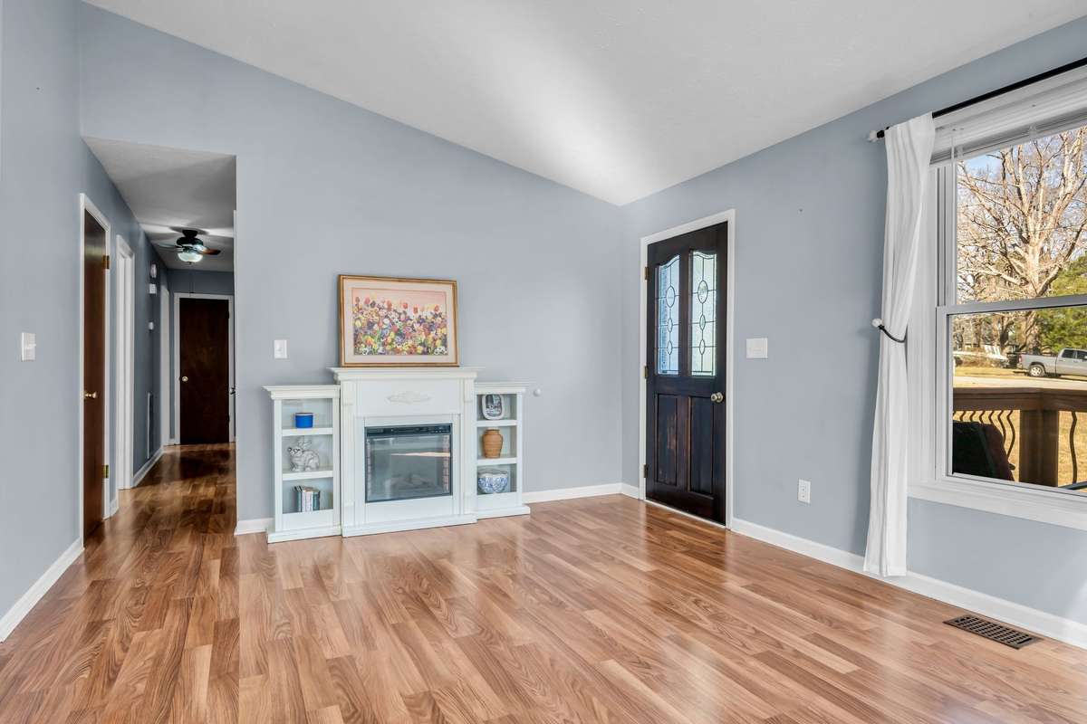Hallway off of living room leads to the three bedrooms and two updated bathrooms