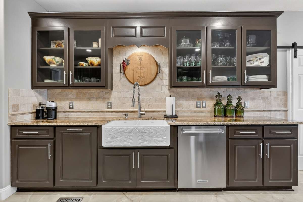 Gorgeous remodeled kitchen with new granite counters, tile floor and a stunning double porcelain barn sink.