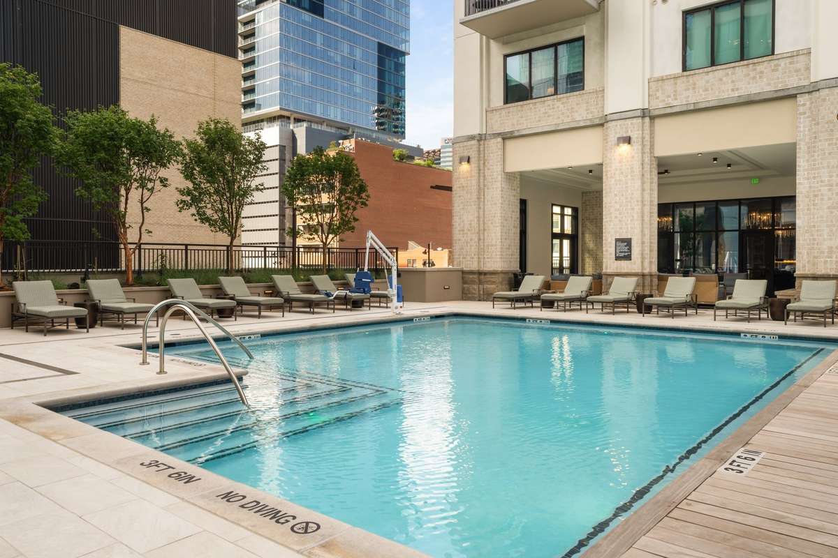 Level 3 - Expansive pool deck with hot tub, state-of-the-art fitness center, outdoor kitchens and living areas.