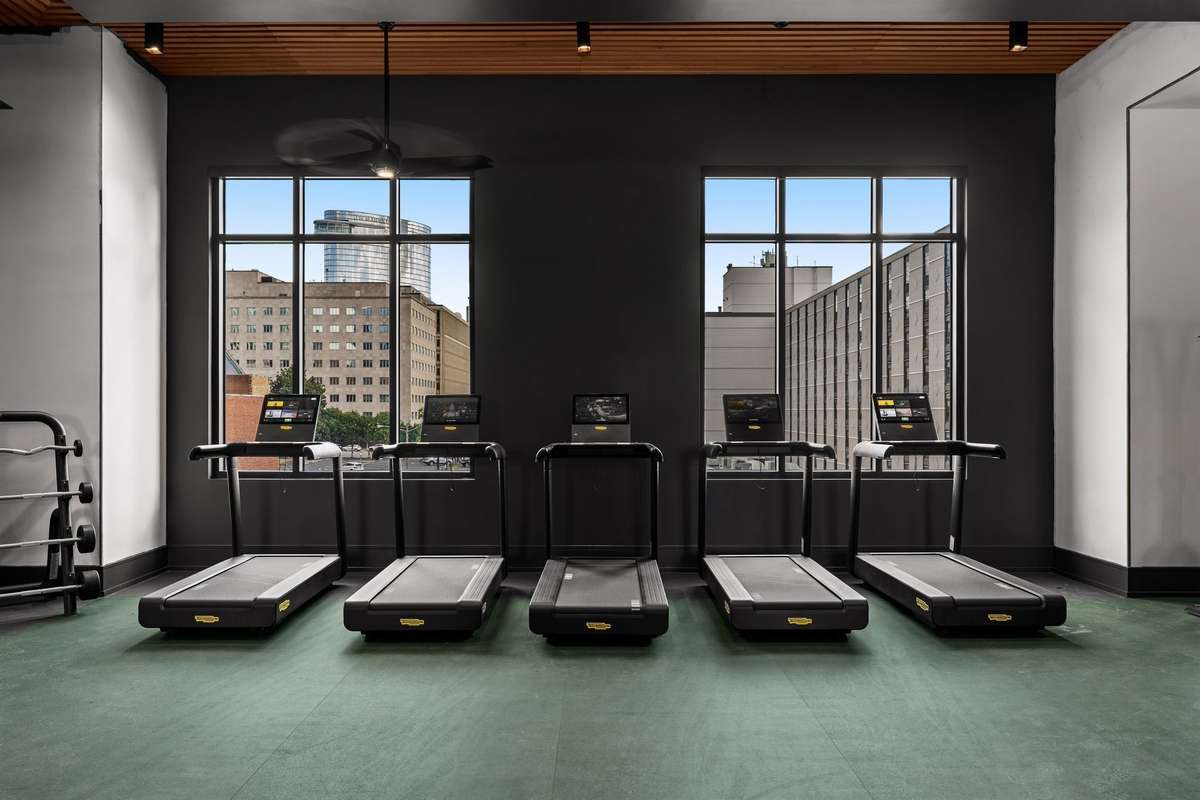 Level 3 - State-of-the-art fitness center featuring a private spin room and a full range of premium equipment for every workout style.