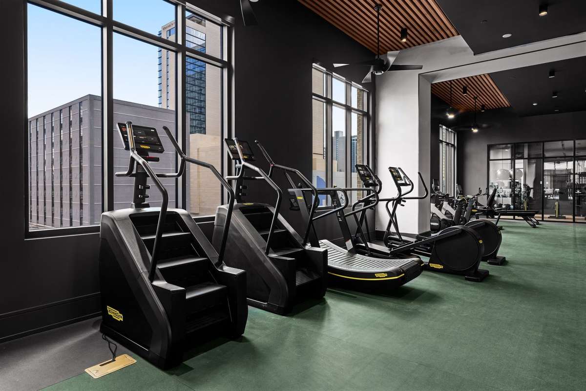 Level 3 - State-of-the-art fitness center featuring a private spin room and a full range of premium equipment for every workout style.