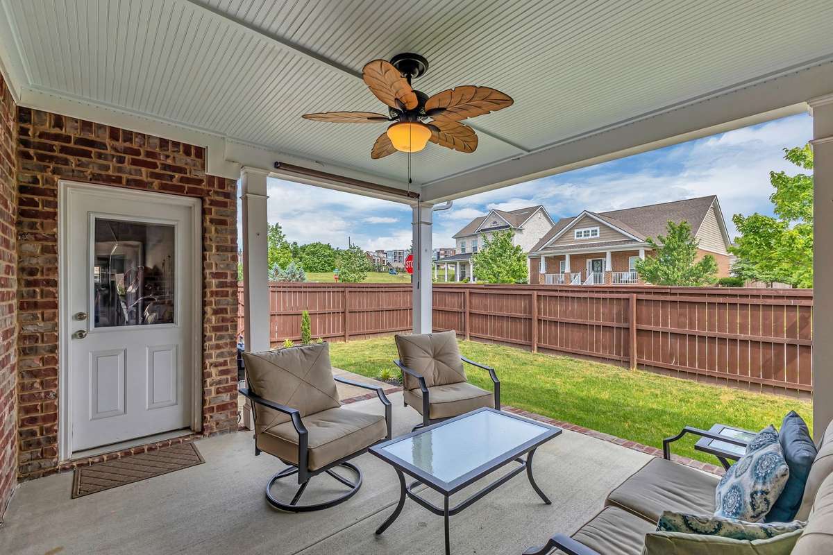 Look At This Cozy Covered Porch Out Back and Level Fenced in Yard