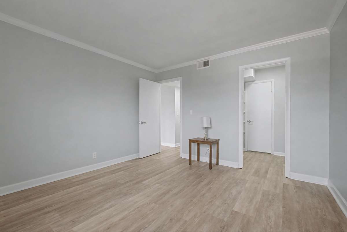The bedroom has a spacious walk-in closet that leads to the newly remodeled bathroom.