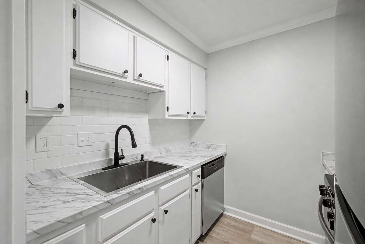 Beautifully redone kitchen with plenty of cabinet space for all of your needs.