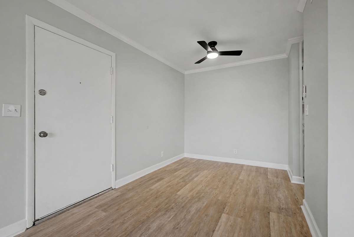 Dining area which includes a new remote-controlled ceiling fan.