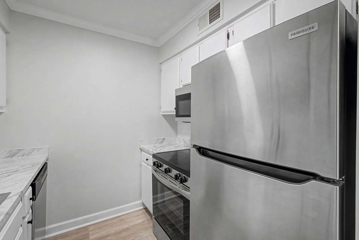 New stainless steel appliances in the kitchen to include, refrigerator, range, microwave, and dishwasher.