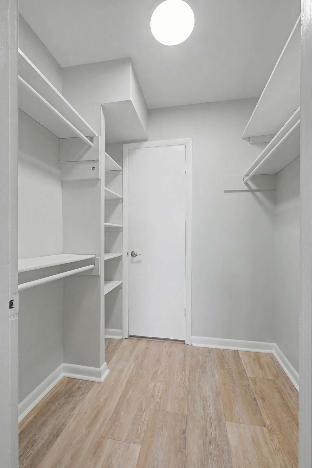 Large walk-in closet with built in shelving and plenty of space to hang all of your clothes.  Freshly painted.