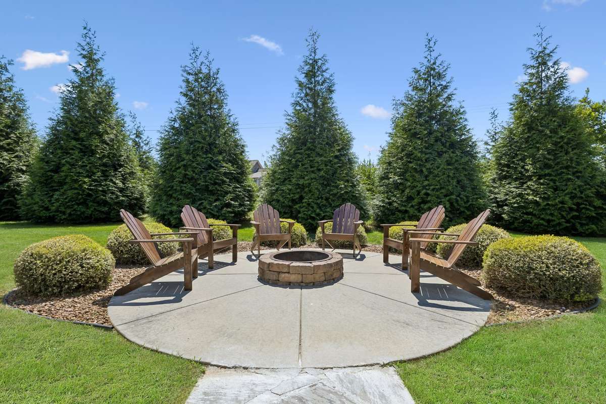 Firepit includes six handcrafted walnut adirondack chairs