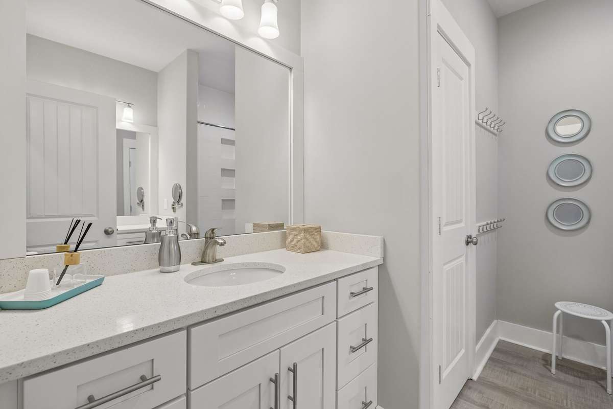 Shared Bunk Room Bathroom with water closet. Plenty of towel hooks for all of your guests.