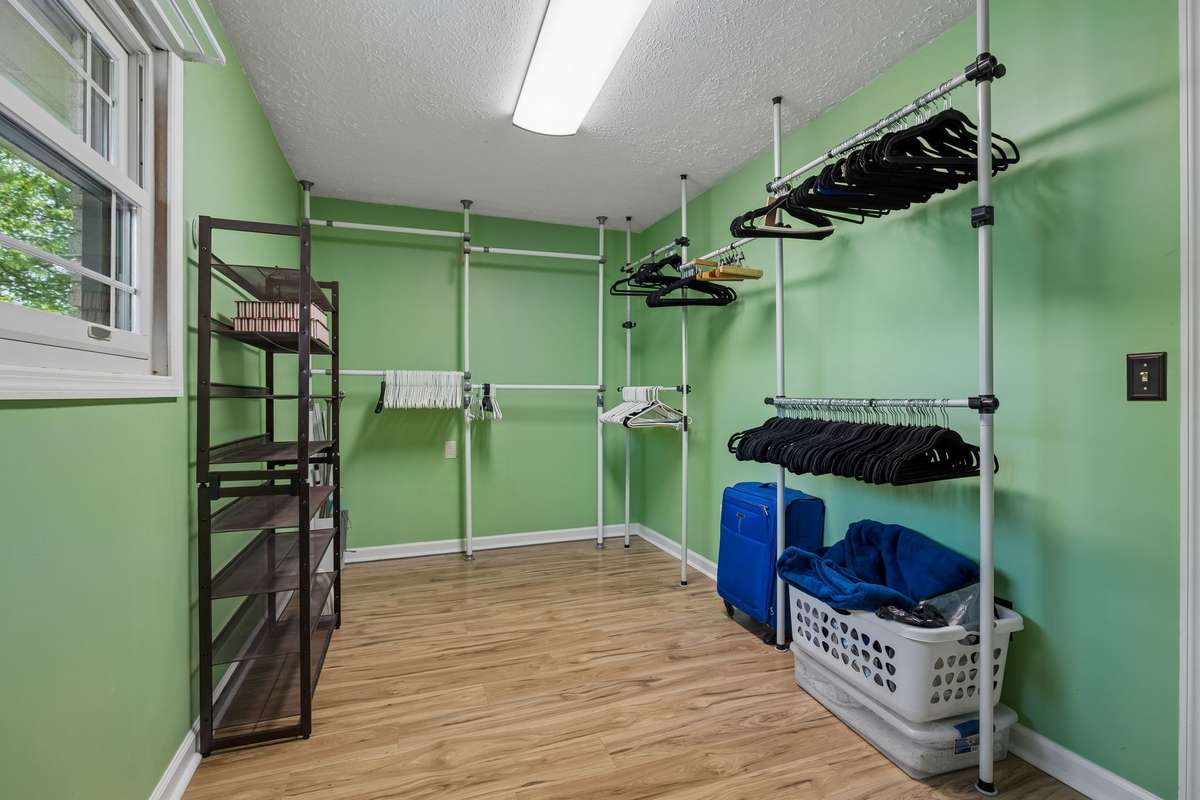 Very large walk-in closet in primary suite