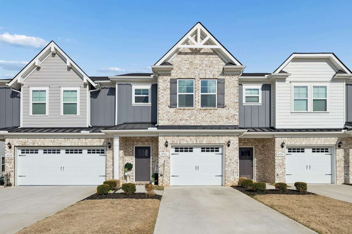 THIS IS A LIKE NEW, GORGEOUS CRAFTSMAN STYLE TOWNHOME WITH THE FEEL OF BEING IN THE COUNTRY.