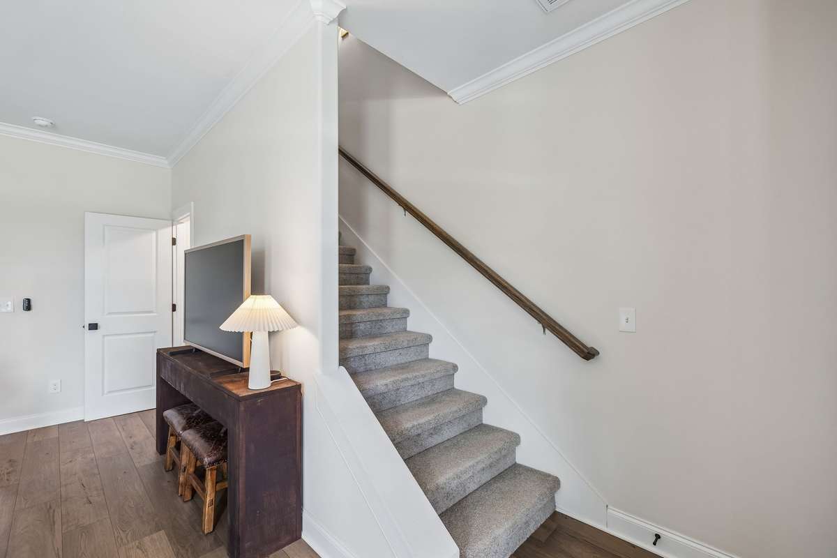 Leading to the Second Level are three bedrooms.  Primary and two additional guest rooms