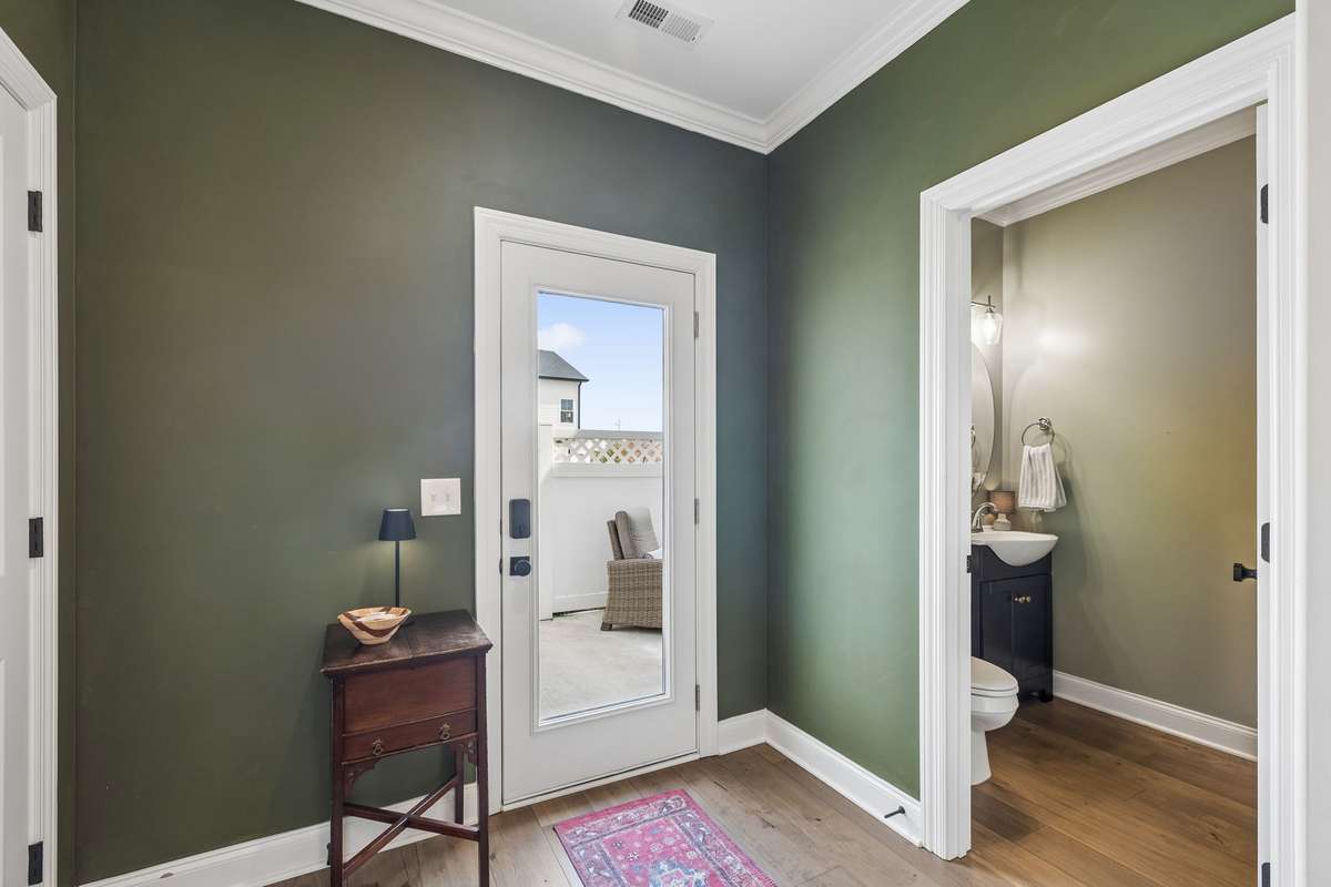 Convenient Back Door off of the Enclosed Patio Area and Parking.