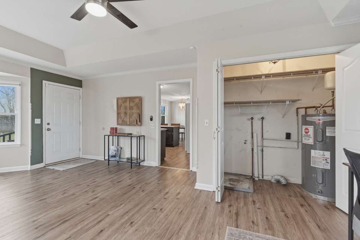 Another view of the bonus/flex space with laundry closet.