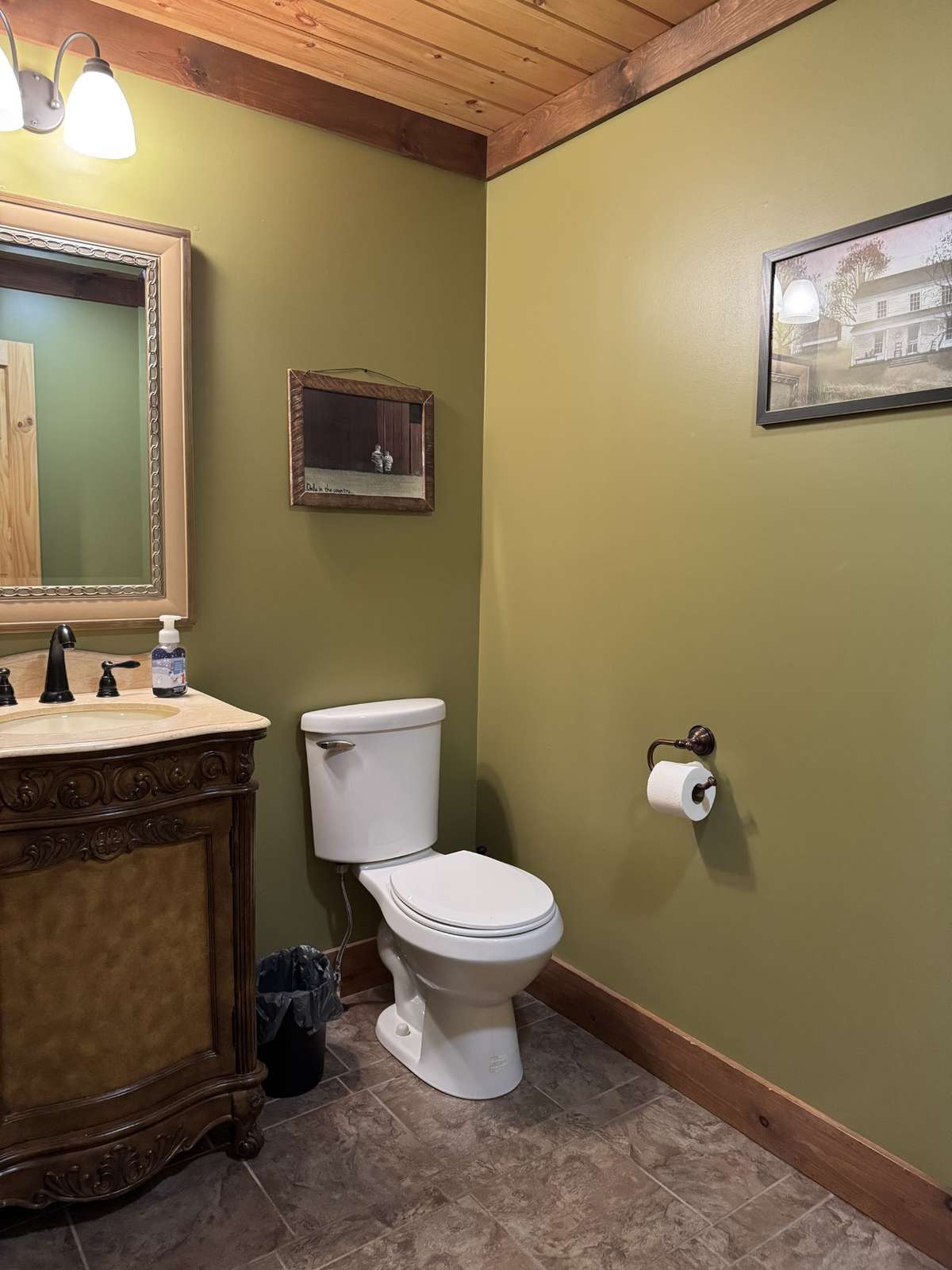 Half bath upstairs in the hall when you come inside from the attached finished garage.