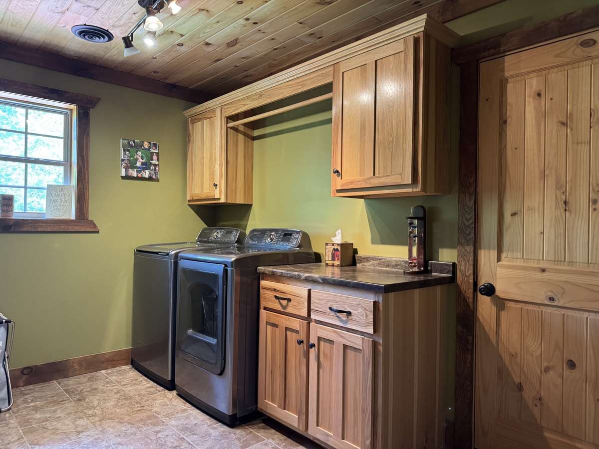 Extra large laundry room on the main floor has a door that takes you up to a huge expansion room currently used for indoor storage but so easy to finish for extra living space or bedrooms.