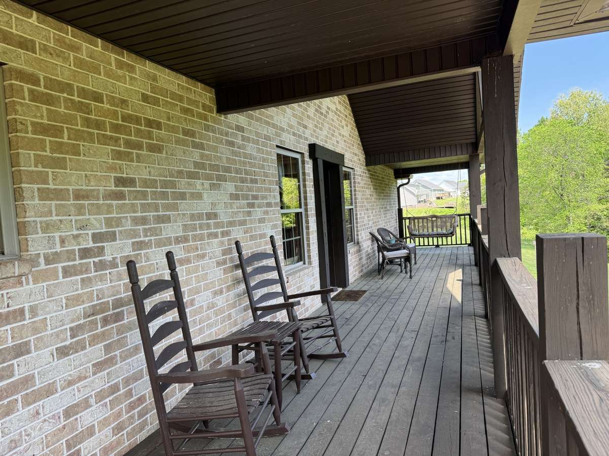 This is your breathtaking full length balcony to enjoy off your main floor living room.  Perfect for bird watching, morning coffee, or reading a book.