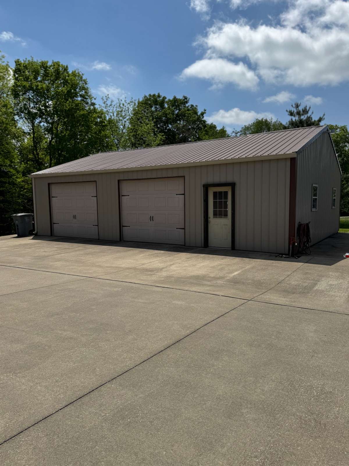 Detached 30x40 shop has tons of storage and is wired
