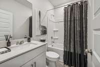 The Hall bath is located between the two secondary bedrooms.
