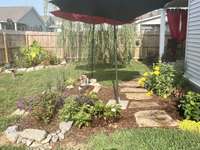 A view of the yard in the spring. Look at all the gorgeous flowers and plants!