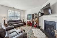 The living room features a gas fireplace.