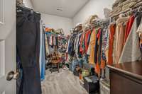 Spacious walk-in closet conveniently located off the bathroom.