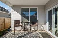 The covered back porch and fenced backyard extend your living space outdoors — perfect for morning coffee or evening cookouts.