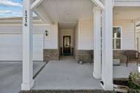 The covered front porch protects your guest from inclement weather when they arrive to visit you in your new home!!