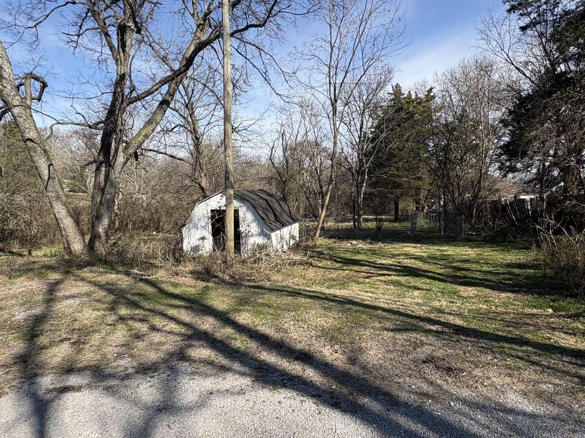 Outbuilding & Partially Fenced-In Yard
