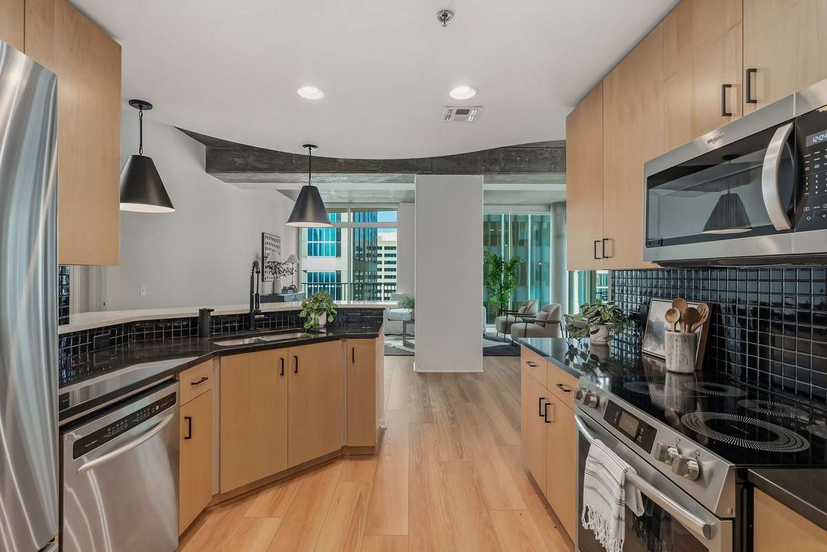 Kitchen featuring new lighting and countertops